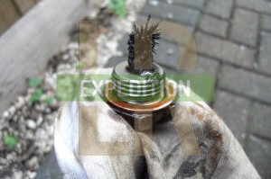LT77 gearbox magnetic drain plug with shards of gearbox attached
